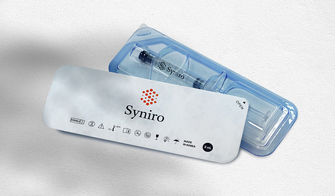 Two Syniro syringes, one upside-down showing branding